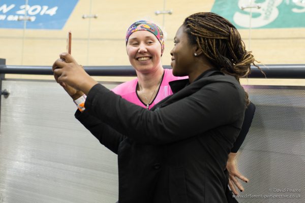 Katie Archibold posing for a selfie with a fan.
